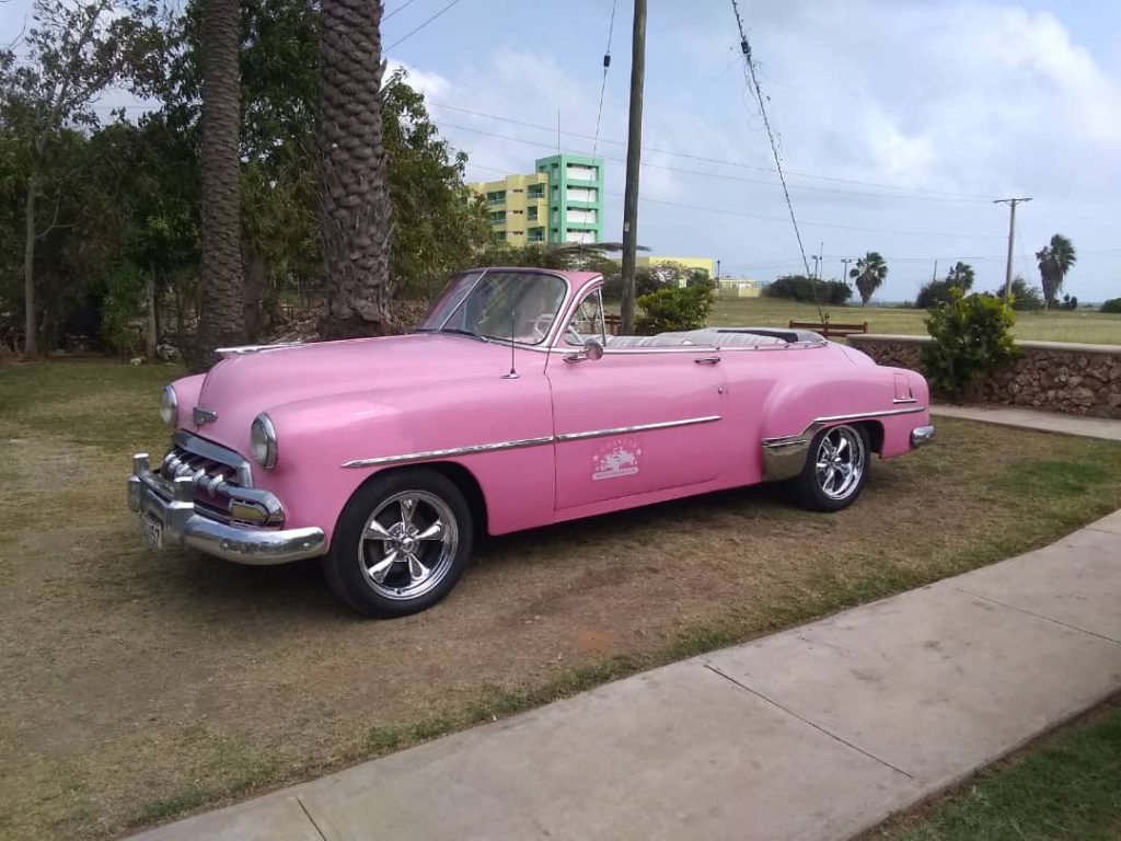 classic car rent in cubachevrolet 52 in cuba pink car